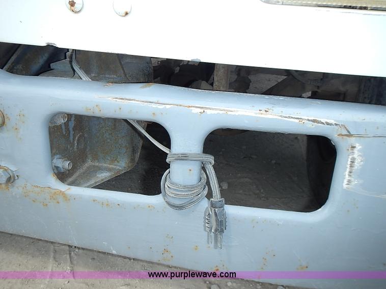 image for item I3549 1995 International 4700 Lo Profile flatbed truck