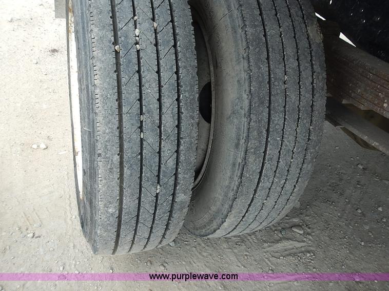 image for item I3549 1995 International 4700 Lo Profile flatbed truck