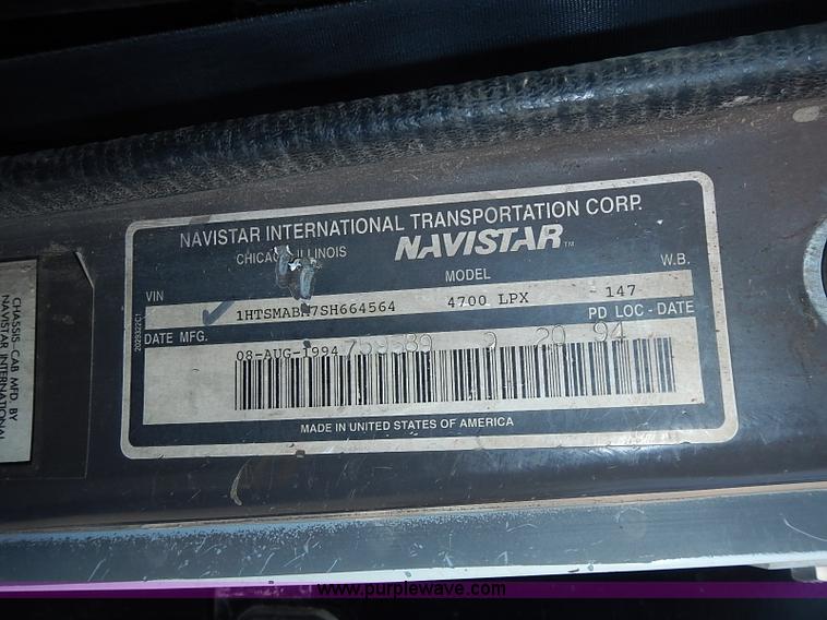 image for item I3549 1995 International 4700 Lo Profile flatbed truck