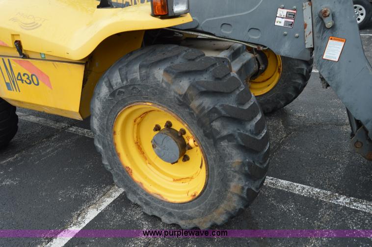 image for item F8334 2002 New Holland LM430 telehandler