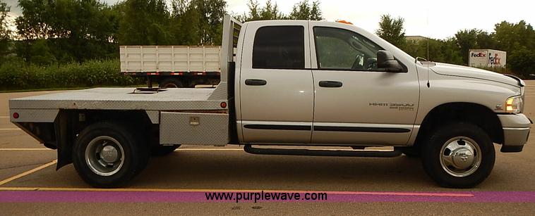 image for item I5493 2005 Dodge Ram 3500 Big Horn Edition Quad Cab flatbed truck