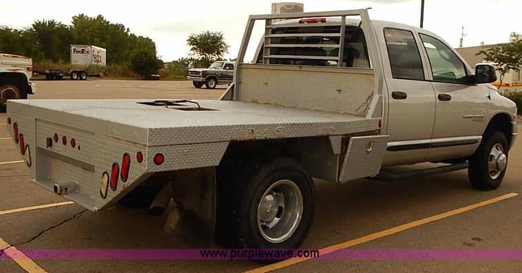 image for item I5493 2005 Dodge Ram 3500 Big Horn Edition Quad Cab flatbed truck