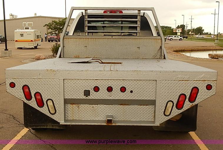 image for item I5493 2005 Dodge Ram 3500 Big Horn Edition Quad Cab flatbed truck