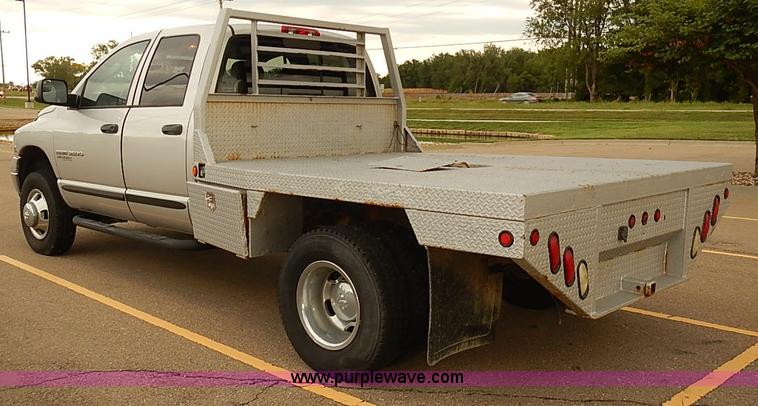 image for item I5493 2005 Dodge Ram 3500 Big Horn Edition Quad Cab flatbed truck