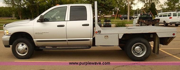 image for item I5493 2005 Dodge Ram 3500 Big Horn Edition Quad Cab flatbed truck