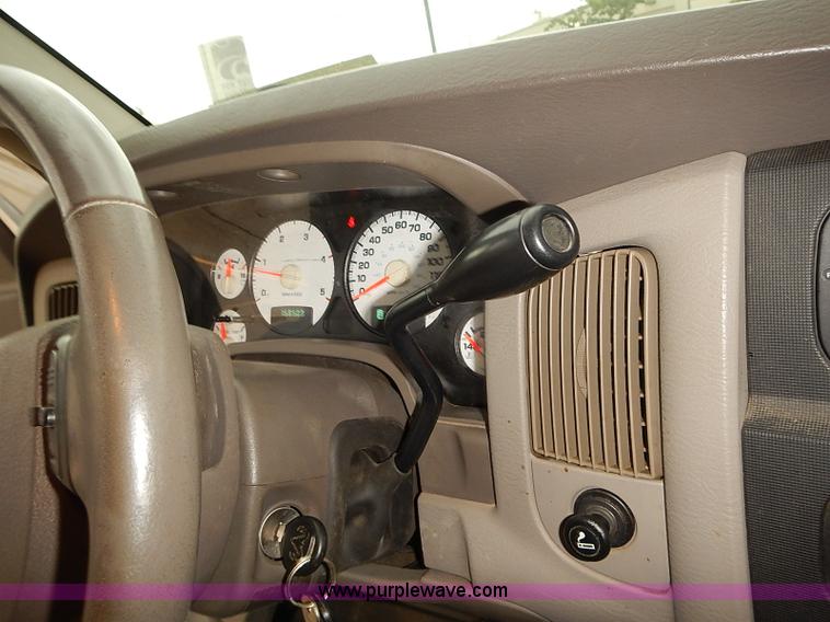 image for item I5493 2005 Dodge Ram 3500 Big Horn Edition Quad Cab flatbed truck