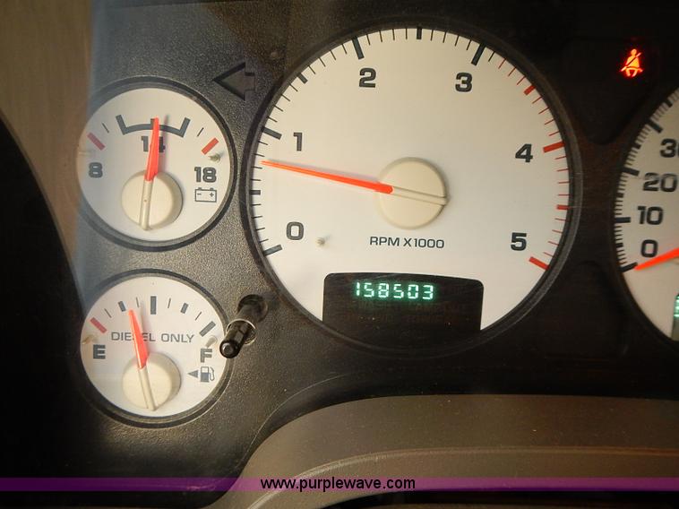 image for item I5493 2005 Dodge Ram 3500 Big Horn Edition Quad Cab flatbed truck