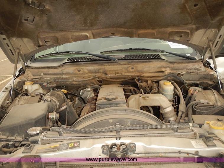 image for item I5493 2005 Dodge Ram 3500 Big Horn Edition Quad Cab flatbed truck