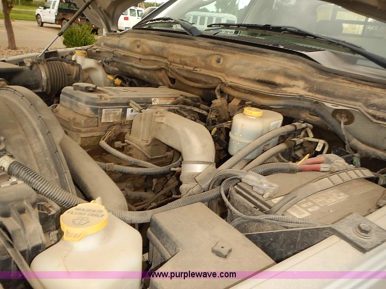 image for item I5493 2005 Dodge Ram 3500 Big Horn Edition Quad Cab flatbed truck