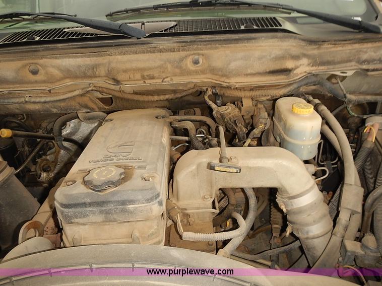 image for item I5493 2005 Dodge Ram 3500 Big Horn Edition Quad Cab flatbed truck