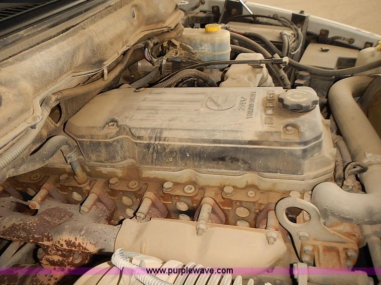 image for item I5493 2005 Dodge Ram 3500 Big Horn Edition Quad Cab flatbed truck