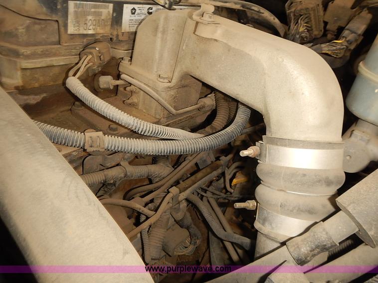 image for item I5493 2005 Dodge Ram 3500 Big Horn Edition Quad Cab flatbed truck