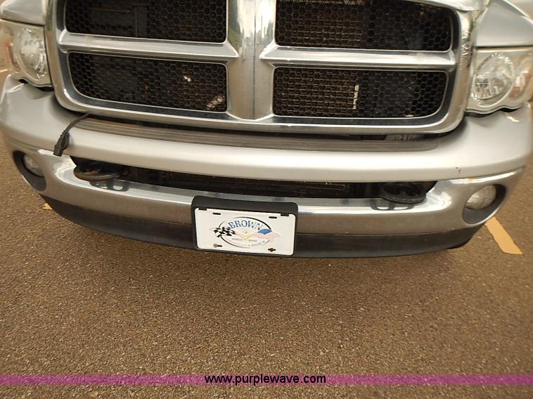 image for item I5493 2005 Dodge Ram 3500 Big Horn Edition Quad Cab flatbed truck