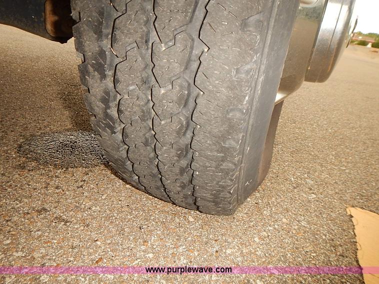 image for item I5493 2005 Dodge Ram 3500 Big Horn Edition Quad Cab flatbed truck