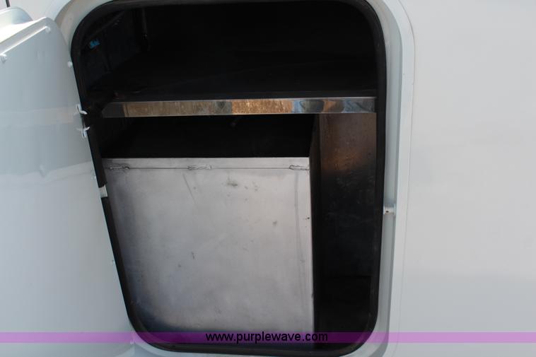 image for item J1141 2001 International 4700 Crew Cab flatbed truck