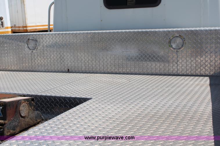 image for item J1141 2001 International 4700 Crew Cab flatbed truck