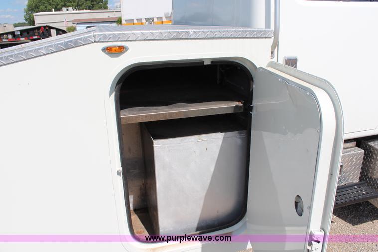 image for item J1141 2001 International 4700 Crew Cab flatbed truck