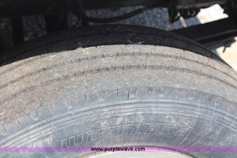 image for item J1141 2001 International 4700 Crew Cab flatbed truck