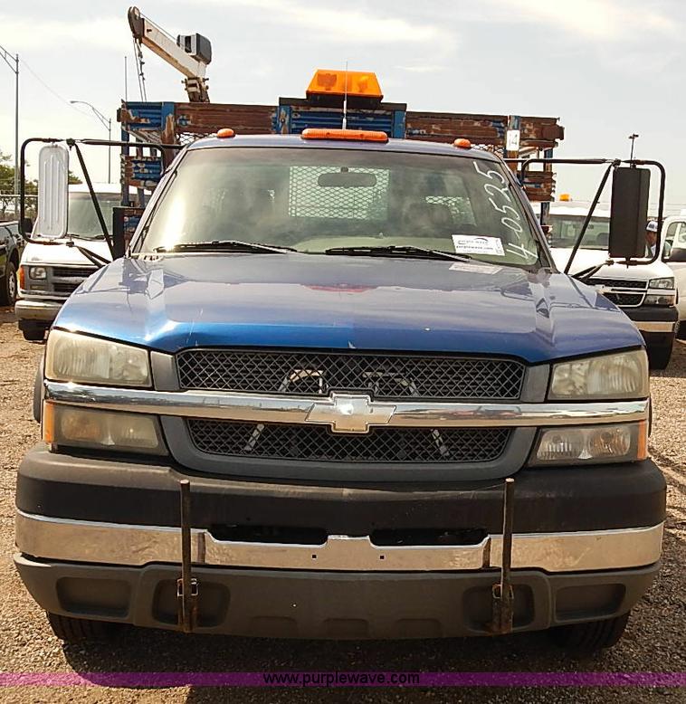 image for item E7779 2003 Chevrolet Silverado 3500 stake body flatbed truck with crane