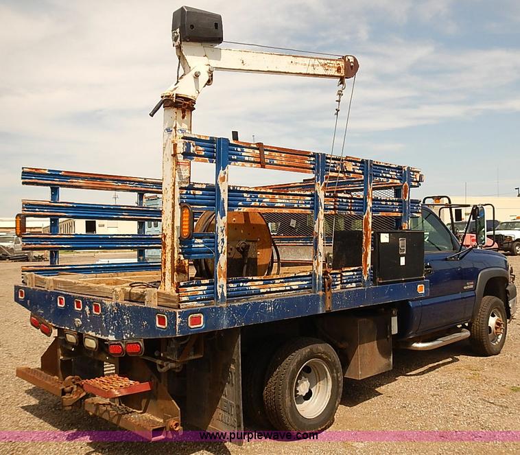 image for item E7779 2003 Chevrolet Silverado 3500 stake body flatbed truck with crane
