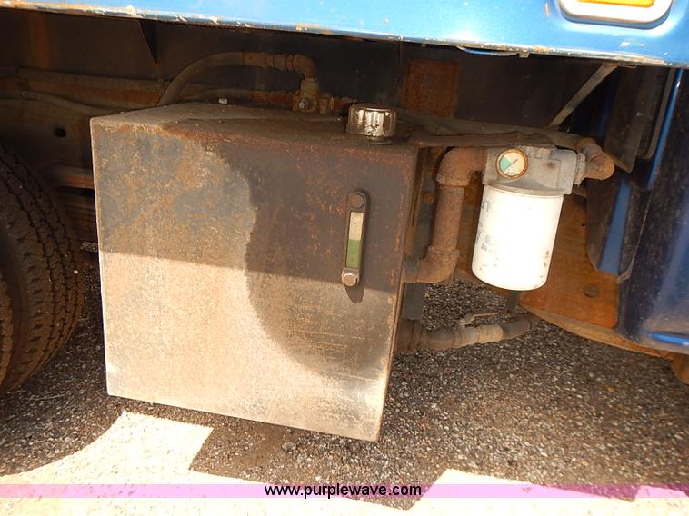 image for item E7779 2003 Chevrolet Silverado 3500 stake body flatbed truck with crane