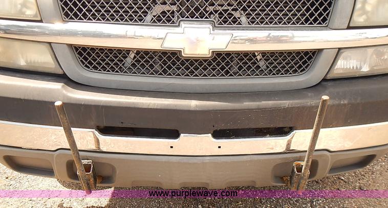 image for item E7779 2003 Chevrolet Silverado 3500 stake body flatbed truck with crane