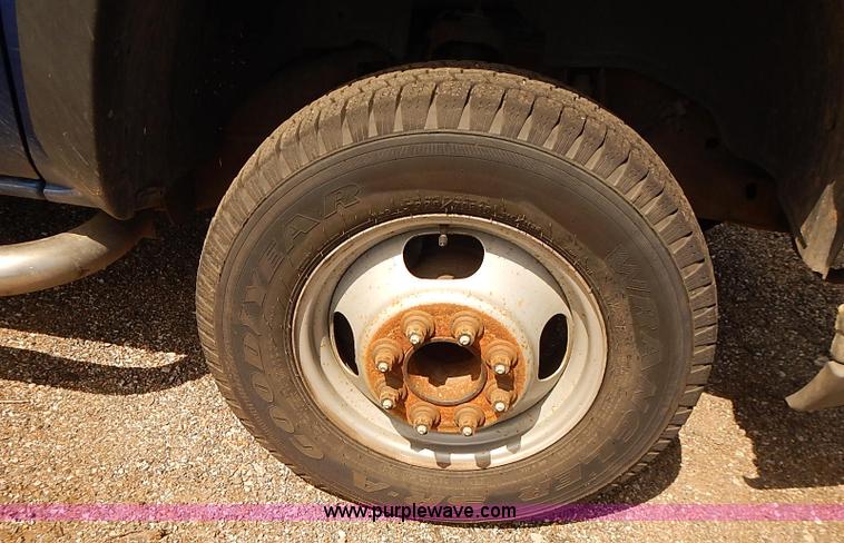 image for item E7779 2003 Chevrolet Silverado 3500 stake body flatbed truck with crane