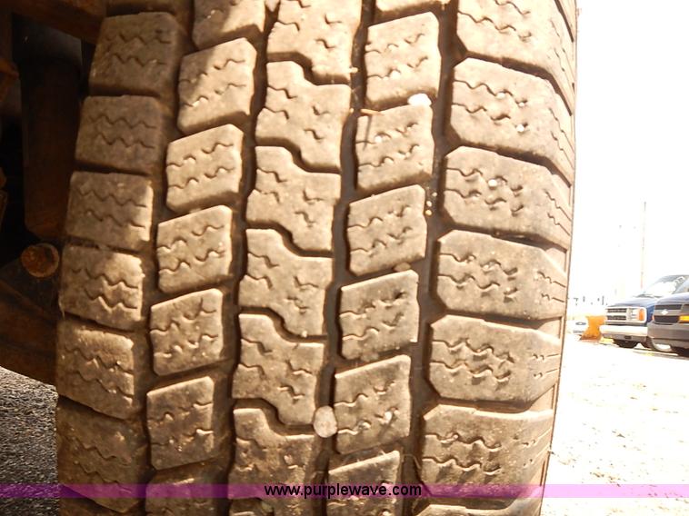 image for item E7779 2003 Chevrolet Silverado 3500 stake body flatbed truck with crane