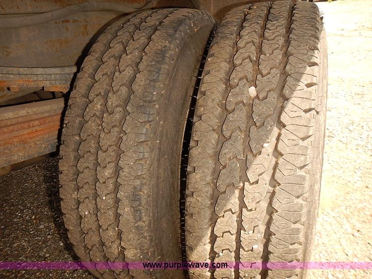 image for item E7779 2003 Chevrolet Silverado 3500 stake body flatbed truck with crane