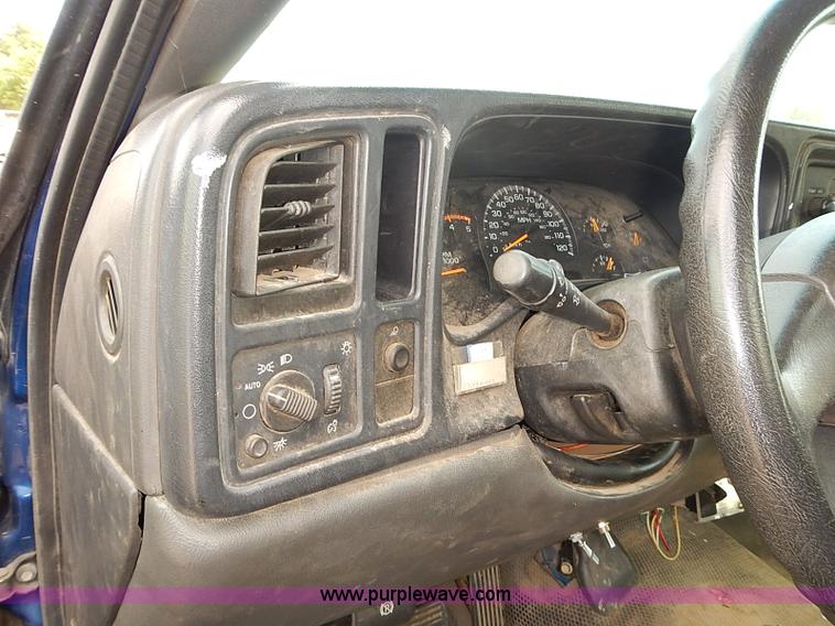 image for item E7779 2003 Chevrolet Silverado 3500 stake body flatbed truck with crane