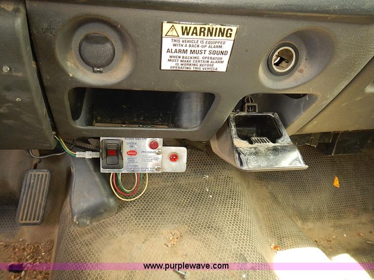 image for item E7779 2003 Chevrolet Silverado 3500 stake body flatbed truck with crane