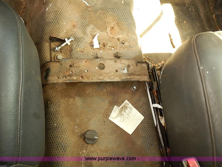 image for item E7779 2003 Chevrolet Silverado 3500 stake body flatbed truck with crane