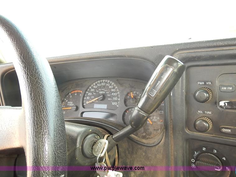 image for item E7779 2003 Chevrolet Silverado 3500 stake body flatbed truck with crane