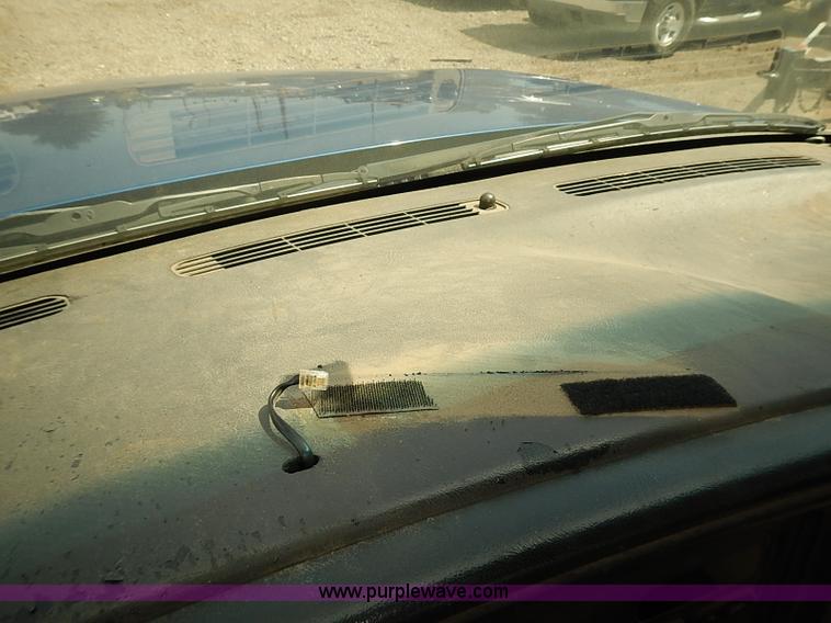 image for item E7779 2003 Chevrolet Silverado 3500 stake body flatbed truck with crane