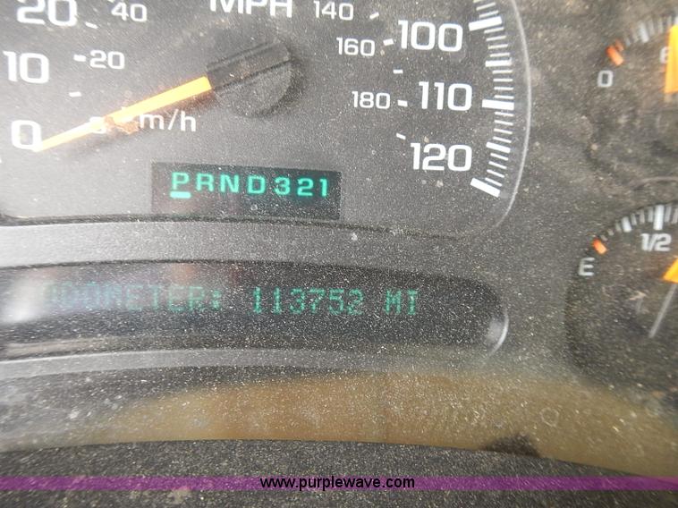 image for item E7779 2003 Chevrolet Silverado 3500 stake body flatbed truck with crane