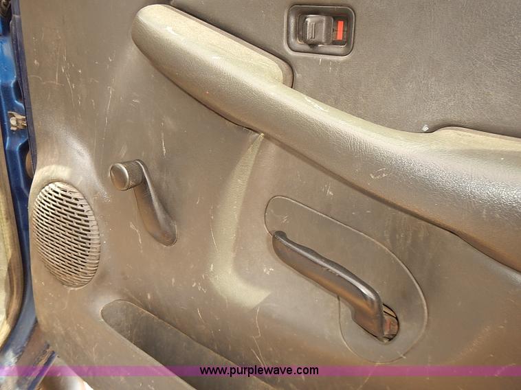 image for item E7779 2003 Chevrolet Silverado 3500 stake body flatbed truck with crane