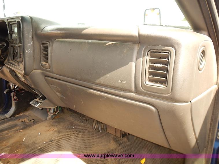 image for item E7779 2003 Chevrolet Silverado 3500 stake body flatbed truck with crane