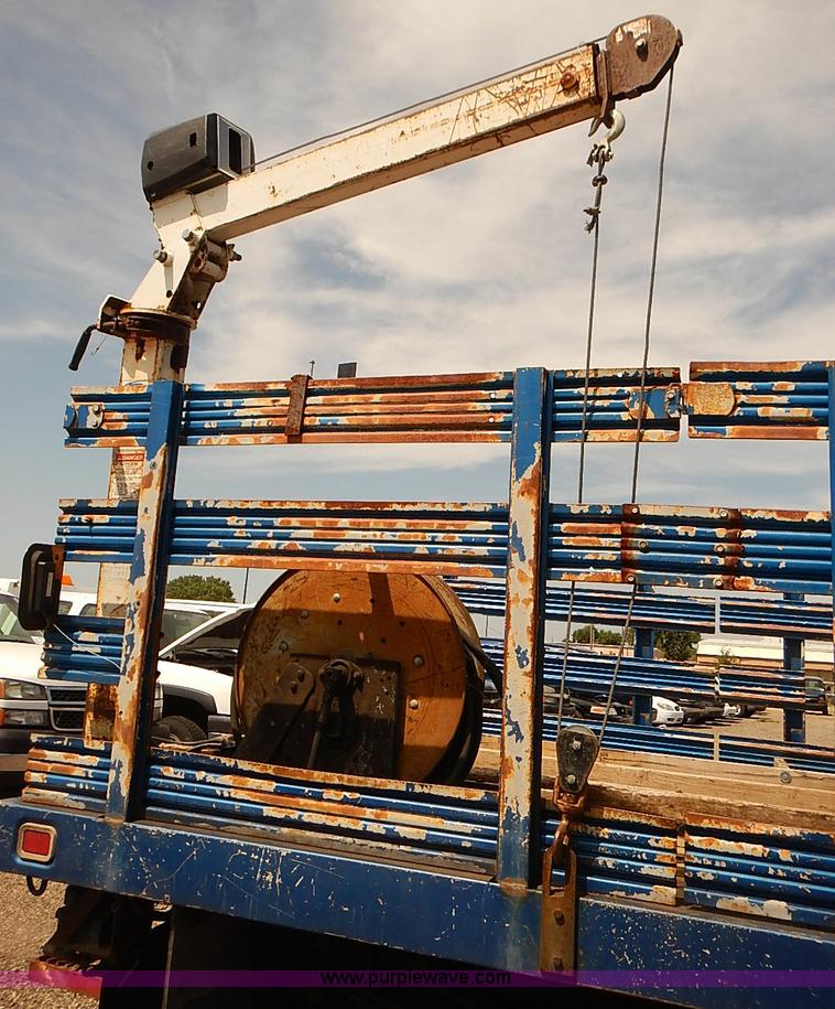 image for item E7779 2003 Chevrolet Silverado 3500 stake body flatbed truck with crane