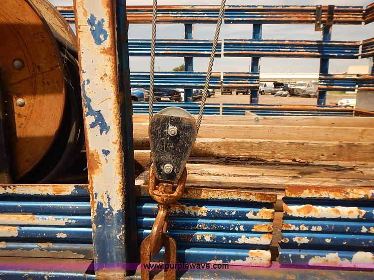 image for item E7779 2003 Chevrolet Silverado 3500 stake body flatbed truck with crane