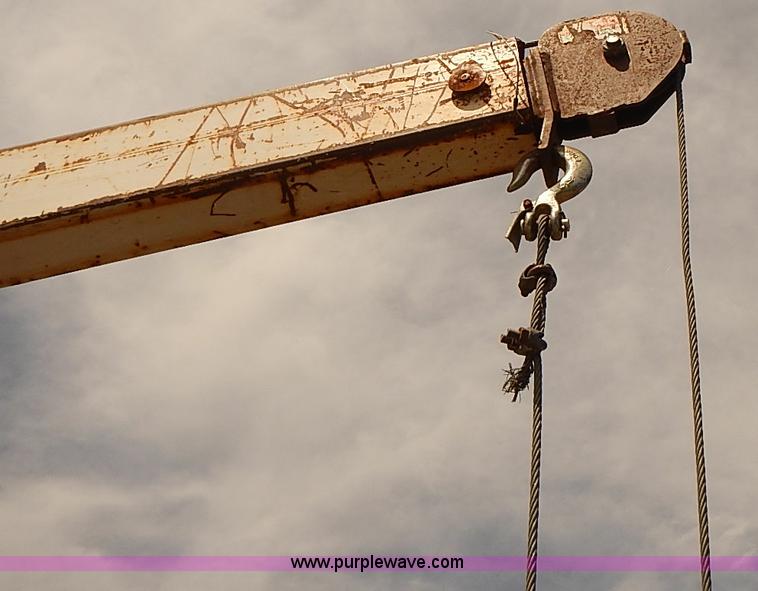 image for item E7779 2003 Chevrolet Silverado 3500 stake body flatbed truck with crane