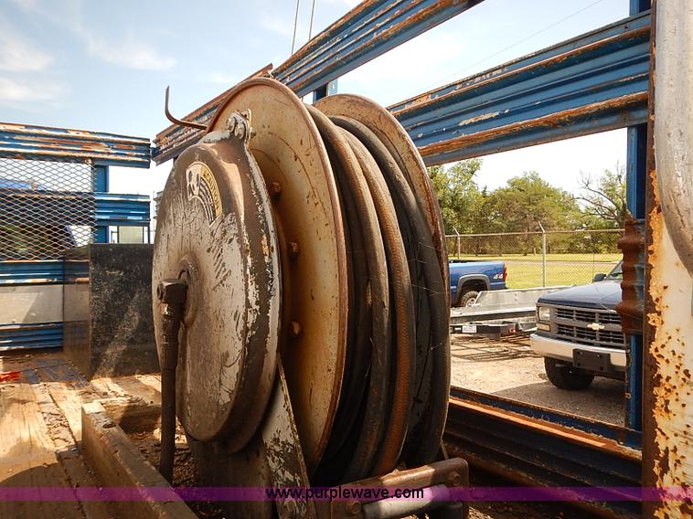 image for item E7779 2003 Chevrolet Silverado 3500 stake body flatbed truck with crane