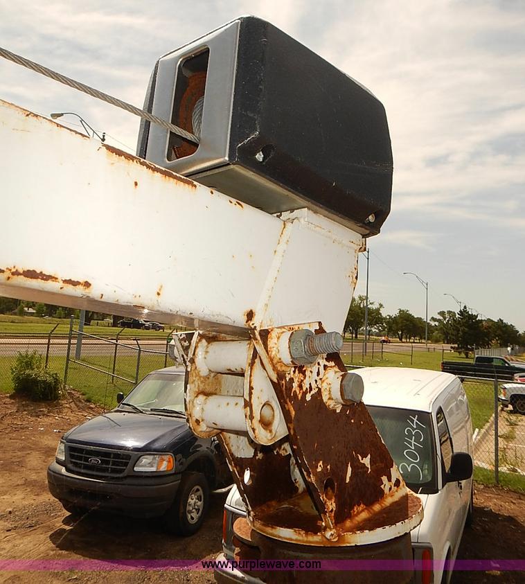 image for item E7779 2003 Chevrolet Silverado 3500 stake body flatbed truck with crane