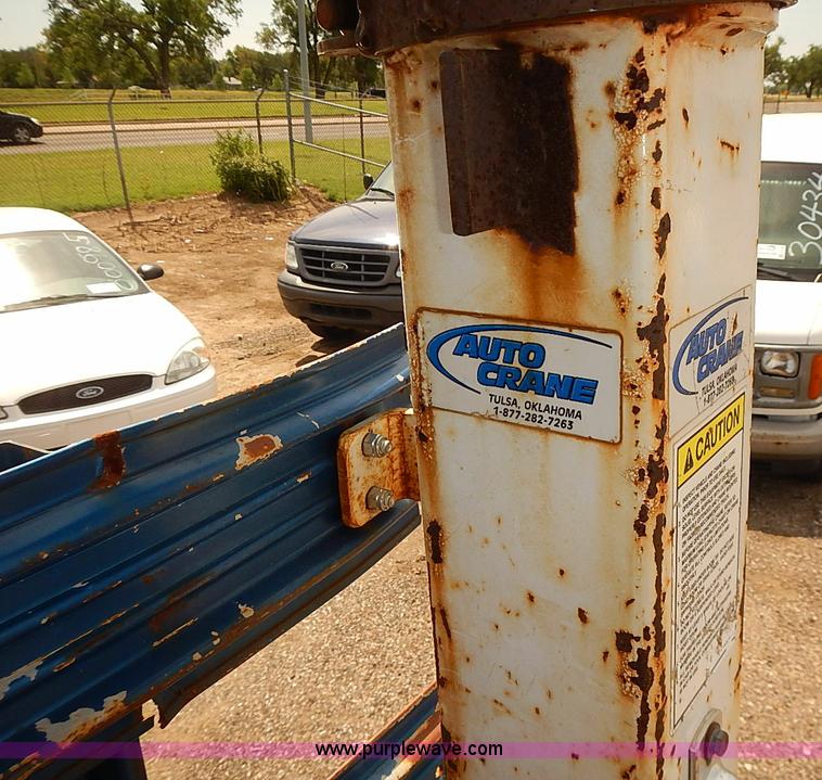 image for item E7779 2003 Chevrolet Silverado 3500 stake body flatbed truck with crane