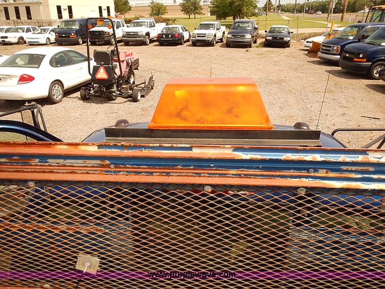 image for item E7779 2003 Chevrolet Silverado 3500 stake body flatbed truck with crane