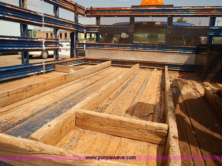 image for item E7779 2003 Chevrolet Silverado 3500 stake body flatbed truck with crane