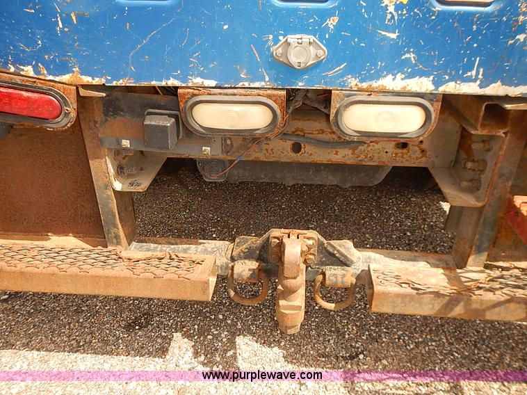 image for item E7779 2003 Chevrolet Silverado 3500 stake body flatbed truck with crane