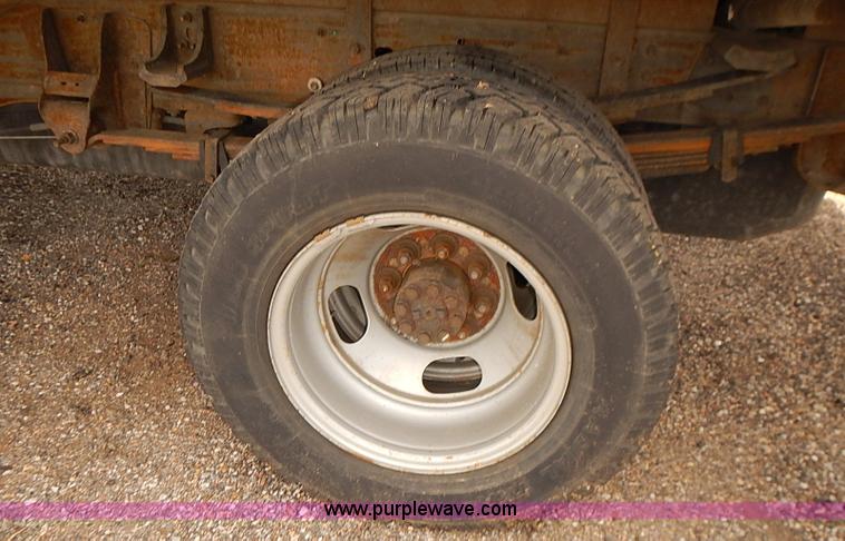 image for item E7779 2003 Chevrolet Silverado 3500 stake body flatbed truck with crane