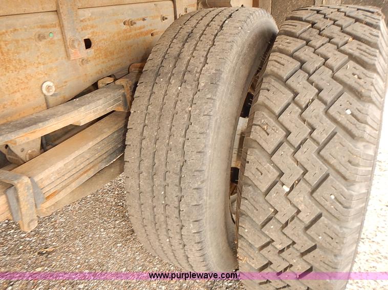 image for item E7779 2003 Chevrolet Silverado 3500 stake body flatbed truck with crane