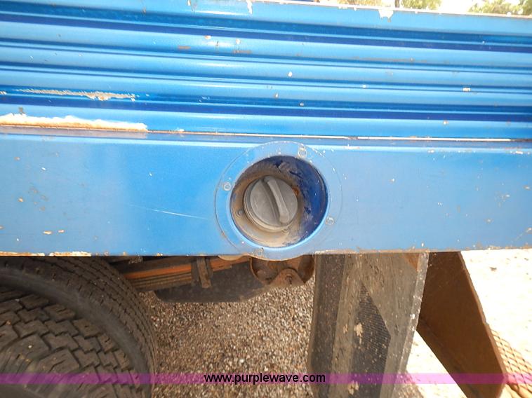 image for item E7779 2003 Chevrolet Silverado 3500 stake body flatbed truck with crane