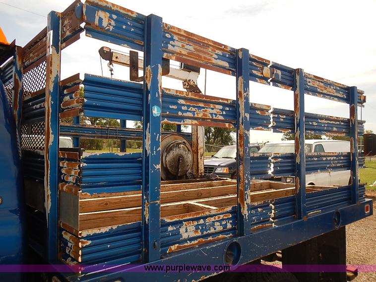 image for item E7779 2003 Chevrolet Silverado 3500 stake body flatbed truck with crane